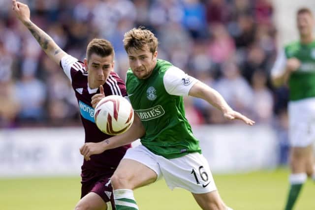 Unlike some of his team-mates, Lewis Stevenson, here clashing with Jamie Walker in 2013, has long experience of city derbies.  Picture: Rob Casey/SNS