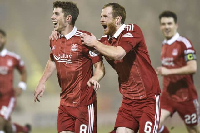 Ryan Christie celebrates with Mark Reynolds after his goal in midweek Picture: SNS.