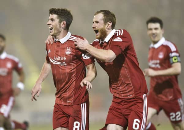 Ryan Christie celebrates with Mark Reynolds after his goal in midweek Picture: SNS.
