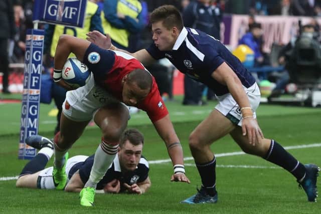 Huw Jones tackles Gael Fickou last week. Picture: David Rogers/Getty Images)