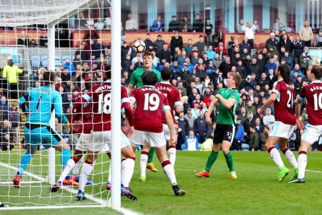 Lincoln City's Sean Raggett puts his side into the FA Cup quarter-final at the expense of Burnley Picture: Martin Rickett/PA Wire