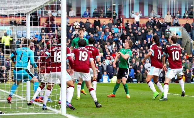 Lincoln City's Sean Raggett puts his side into the FA Cup quarter-final at the expense of Burnley Picture: Martin Rickett/PA Wire