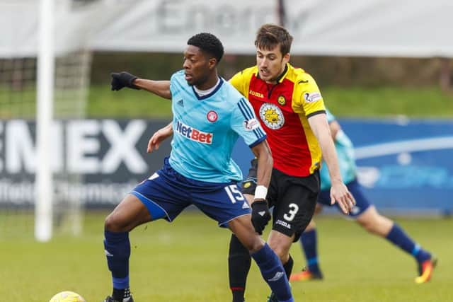 Hamilton's Rakish Bingham battles for the ball against Thistle's Callum Booth. Picture: SNS/Roddy Scott