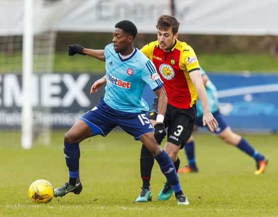 Hamilton's Rakish Bingham battles for the ball against Thistle's Callum Booth. Picture: SNS/Roddy Scott