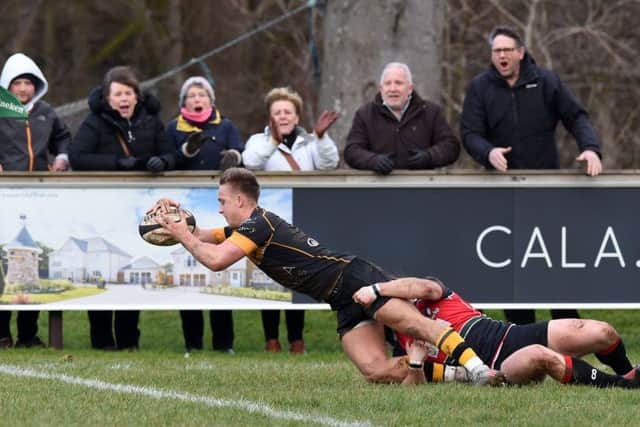 Curries Harvey Elms dives over the line to score the opening try of the match at Malleny. Picture: Paul Devlin/SNS/SRU