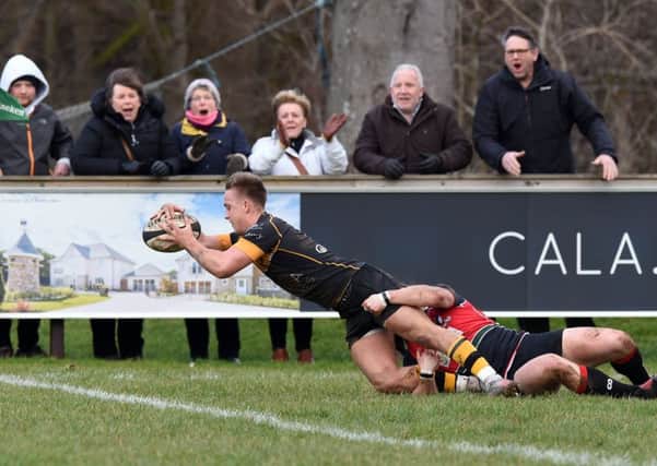 Curries Harvey Elms dives over the line to score the opening try of the match at Malleny. Picture: Paul Devlin/SNS/SRU