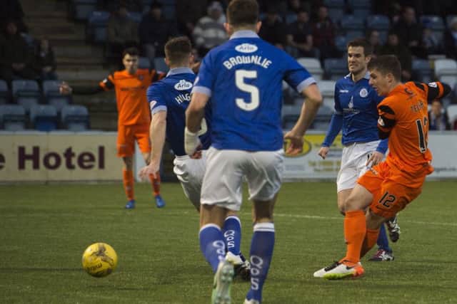 Dundee Uniteds Charlie Telfer, right, scores his sides opening goal.  
Photograph: Craig Foy/SNS