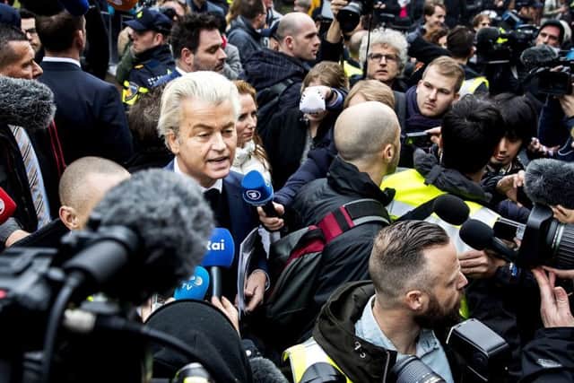 Dutch far-right Freedom Party leader Geert Wilders (C) speaks to journalists as he officially launches his parliamentary election campaign. Picture: Koen van Weel /FP/Getty Images