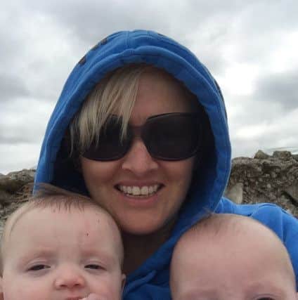 Zoe Sullivan with her children Leah and Erin. Picture: SWNS