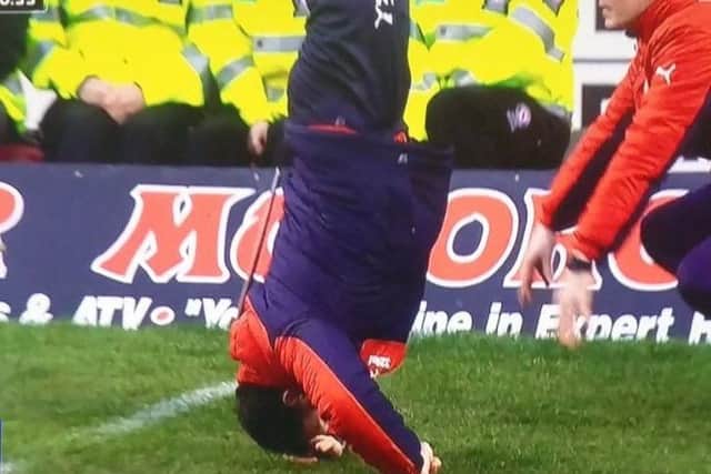 Rangers interim manager Graeme Murty cuts a frustrated, upside down figure.