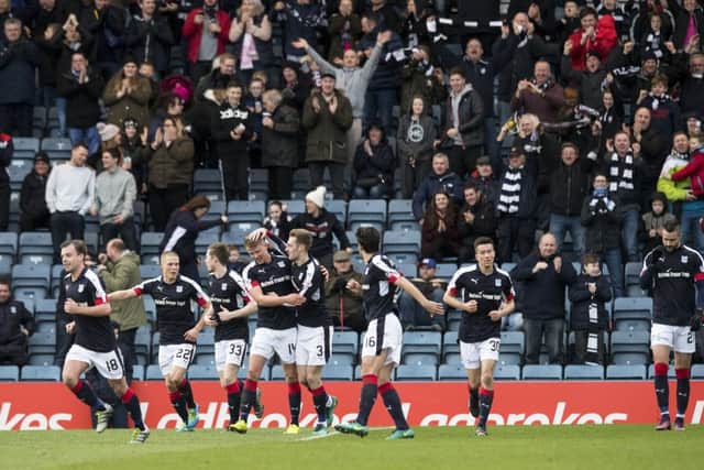 Dundee celebrate after Kevin Holt doubles the home side's advantage. Picture: SNS