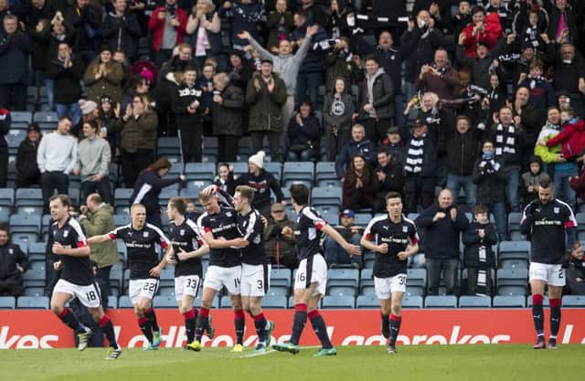 Dundee celebrate after Kevin Holt doubles the home side's advantage. Picture: SNS