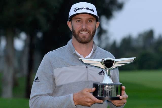 Dustin Johnson shows off the Genesis Open trophy after his five-shot success. Picture: Getty Images