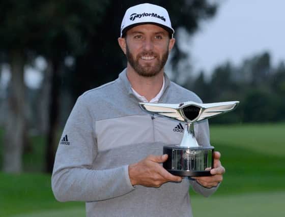 Dustin Johnson shows off the Genesis Open trophy after his five-shot success. Picture: Getty Images