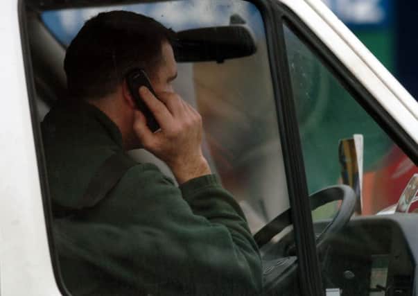 Drivers caught on their mobile phones will now recieve a Â£200 fine. Picture: Ian Rutherford