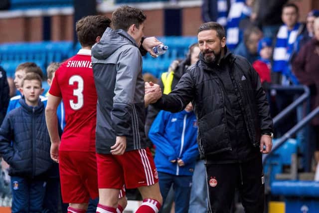 Aberdeen's Ryan Christie and manager Derek McInnes (right) celebrate at full time. Picture: SNS