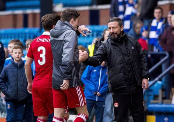 Aberdeen's Ryan Christie and manager Derek McInnes (right) celebrate at full time. Picture: SNS
