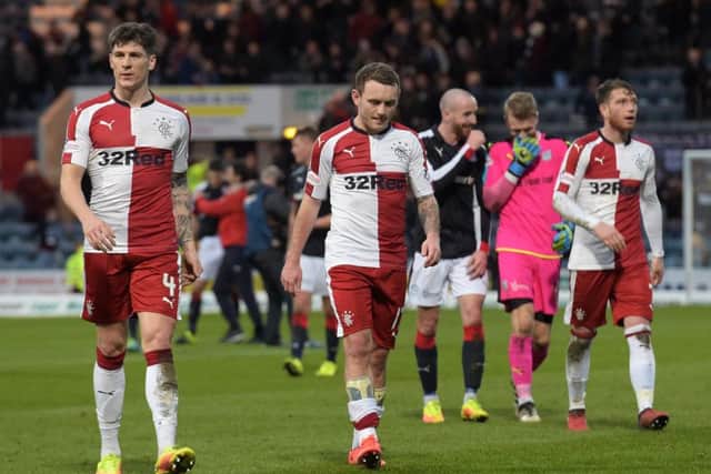 A defeated Rangers squad trudge off at full-time after losing 2-1 to Dundee. Picture: SNS