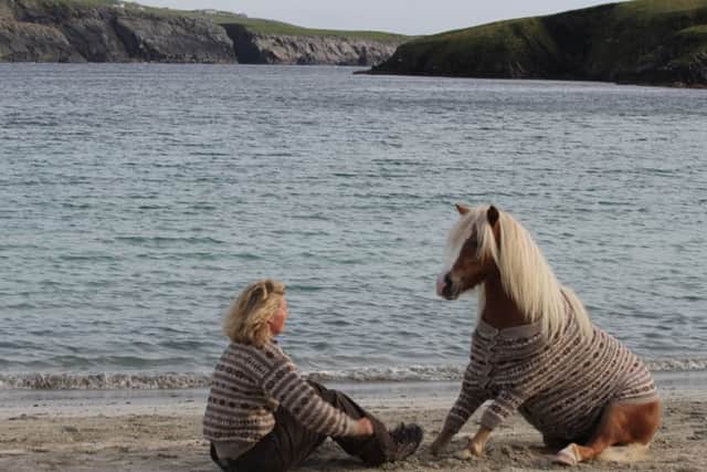 Horse whisperer Emma Massingale on Shetland Isles with one of the two ponies. Picture: SWNS