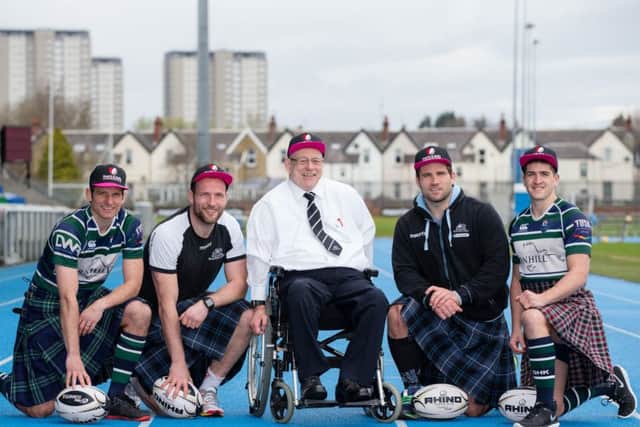 Jim Taylor, the Hearts and Balls ambassador, with rugby players from Glasgow Warriors and GHK rugby club. Picture: Martin Shields/Contributed