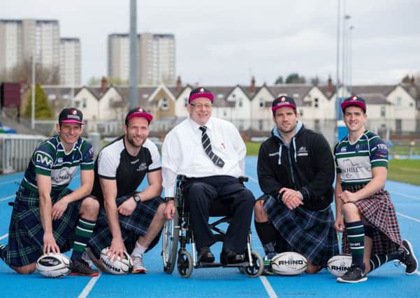 Jim Taylor, the Hearts and Balls ambassador, with rugby players from Glasgow Warriors and GHK rugby club.  Picture: Martin Shields/Contributed