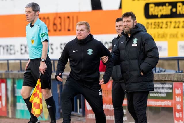 Hibs manager Neil Lennon is held back by assistant Garry Parker during the draw with Raith Rovers. Picture: Ross Parker/SNS