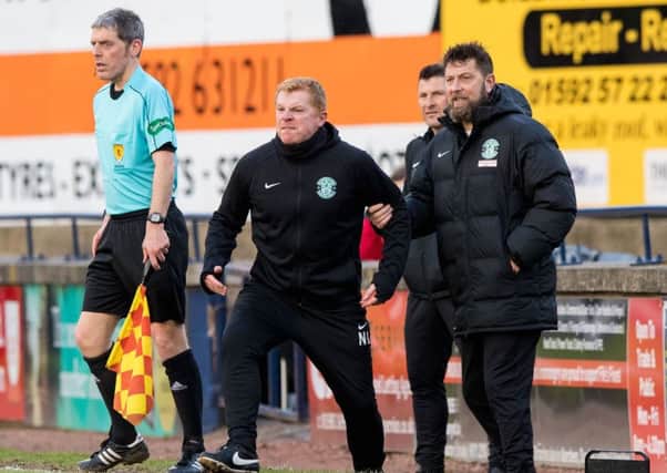Hibs manager Neil Lennon is held back by assistant Garry Parker during the draw with Raith Rovers. Picture: Ross Parker/SNS
