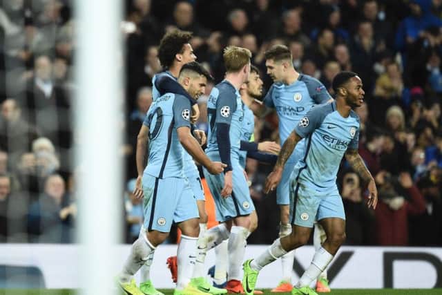 Manchester City midfielder Leroy Sane celebrates with team-mates after scoring their fifth goal against Monaco at the Etihad Stadium. Picture: AFP/Getty Images