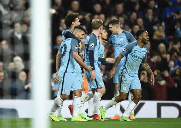 Manchester City midfielder Leroy Sane celebrates with team-mates after scoring their fifth goal against Monaco at the Etihad Stadium. Picture: AFP/Getty Images