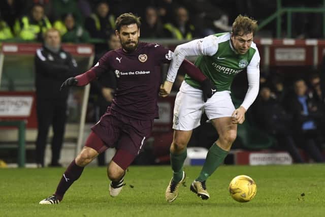 Hearts Alexandros Tziolis, left, and Grant Holt narked each other throughout the game.