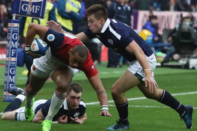 Scotland centre Huw Jones prepares to  tackle Gael Fickou of France  at Stade de France earlier this month. Picture: .   David Rogers/Getty Images