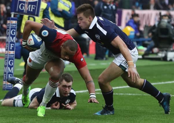 Scotland centre Huw Jones prepares to  tackle Gael Fickou of France  at Stade de France earlier this month. Picture: .   David Rogers/Getty Images