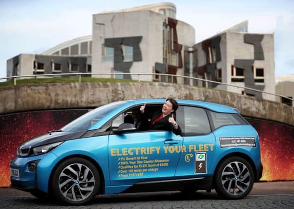 Ruth Davidson tries out an electric car to launch the Scottish Conservatives new environment policy. Picture: PA