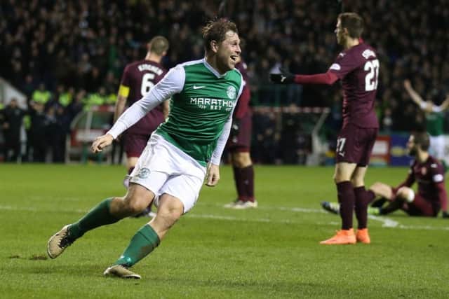 Grant Holt celebrates putting Hibs two up against Hearts