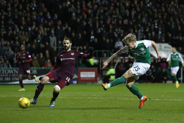 Jason Cummings opens the scoring against Hearts in Hibs' Scottish Cup fifth-round triumph. Picture: PA
