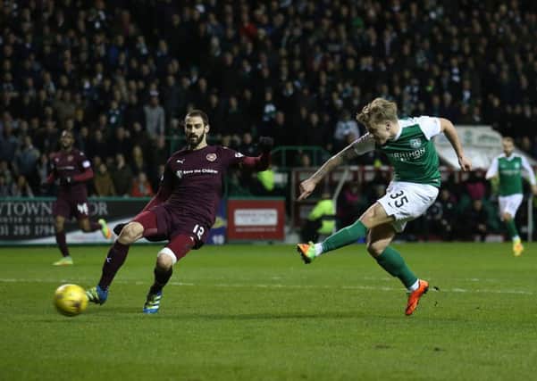 Jason Cummings opens the scoring against Hearts in Hibs' Scottish Cup fifth-round triumph. Picture: PA