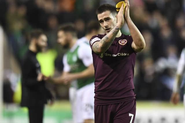 Jamie Walker, seen applauding the fans at full-time, questioned the desire of his team-mates. Picture: SNS