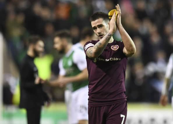 Jamie Walker, seen applauding the fans at full-time, questioned the desire of his team-mates. Picture: SNS