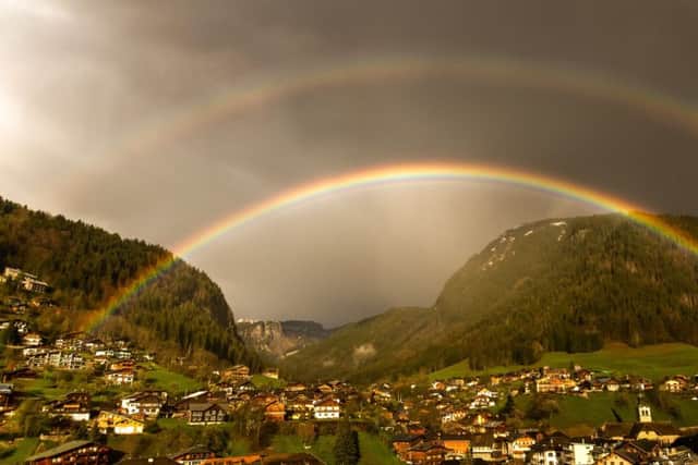 A double rainbow over the Alpine resort of Morzine