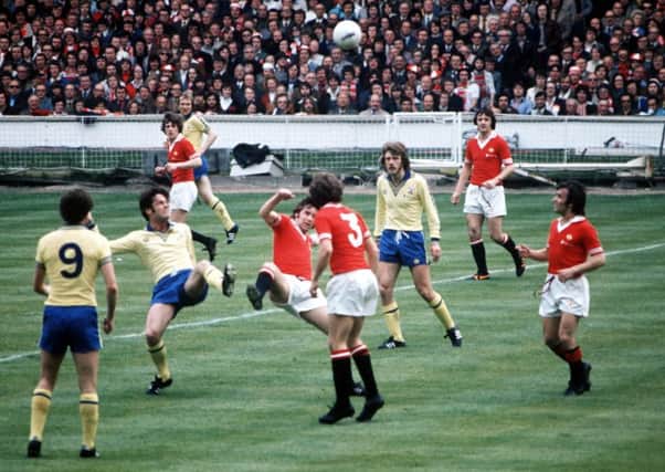 Lou Macari, right, looks on as another two Scots, Southamptons Jim McCalliog and Uniteds Martin Buchan battle for possession in the Wembley showpiece. Picture: Bob Thomas/Getty Images)