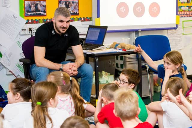 Hearts defender Callum Paterson, pictured as he visits his former primary school at Queensferry,says his team need to man up after their defeat by Hibs. Picture: SNS