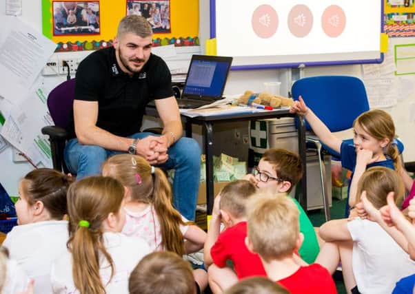 Hearts defender Callum Paterson, pictured as he visits his former primary school at Queensferry,says his team need to man up after their defeat by Hibs. Picture: SNS