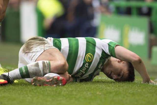 Celtic's Kieran Tierney after a bad challenge from Motherwell attacker Ryan Bowman. Picture: SNS