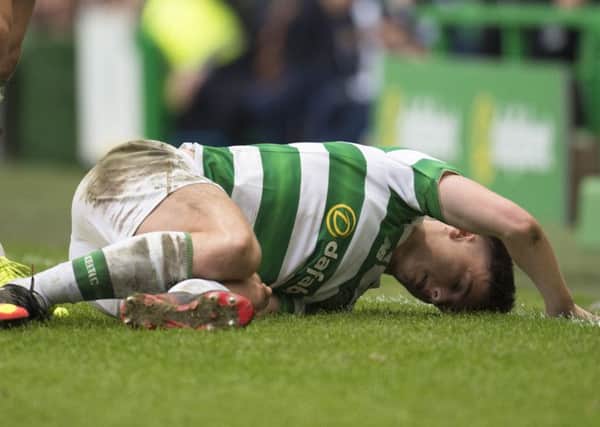 Celtic's Kieran Tierney after a bad challenge from Motherwell attacker Ryan Bowman. Picture: SNS