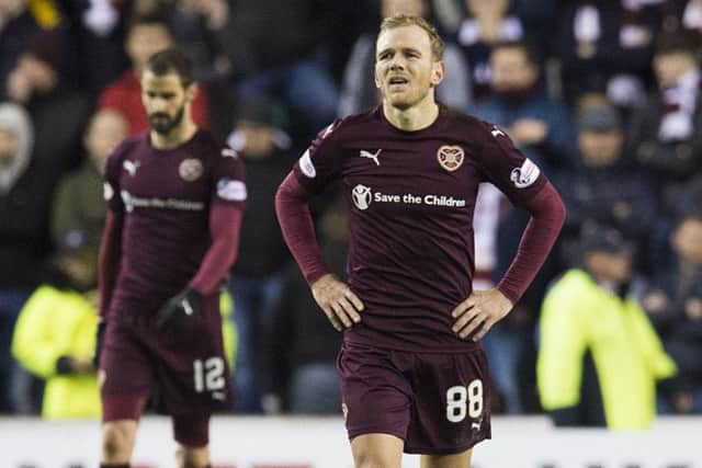 Hearts' Malaury Martin cuts a dejected figure at Easter Road. He was substituted at half time. Picture: Craig Foy/SNS