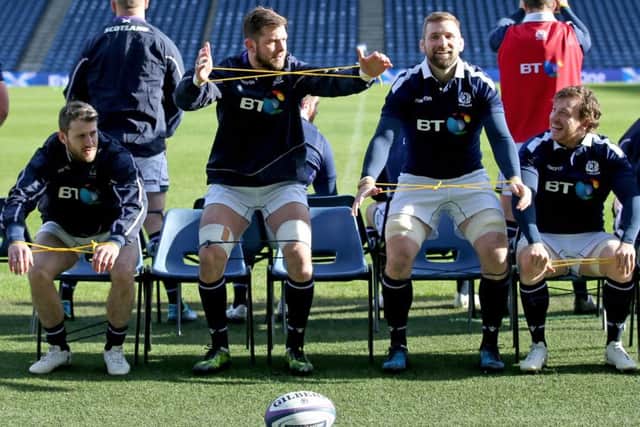 Scotland's Tommy Seymour, Ryan Wilson, John Barclay and Hamish Watson stretch off during the final training session ahead of the match against Wales. Picture: Jane Barlow/PA Wire