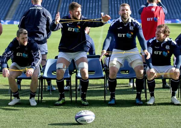 Scotland's Tommy Seymour, Ryan Wilson, John Barclay and Hamish Watson stretch off during the final training session ahead of the match against Wales. Picture: Jane Barlow/PA Wire