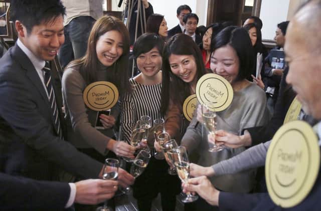 Office workers of Tokyo  toast  "Premium Friday"  (AP Photo/Koji Sasahara)