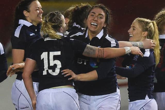 The Scotland players celebrate their win over Wales at full-time. Picture: SNS