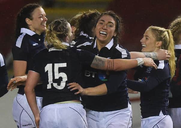 The Scotland players celebrate their win over Wales at full-time. Picture: SNS